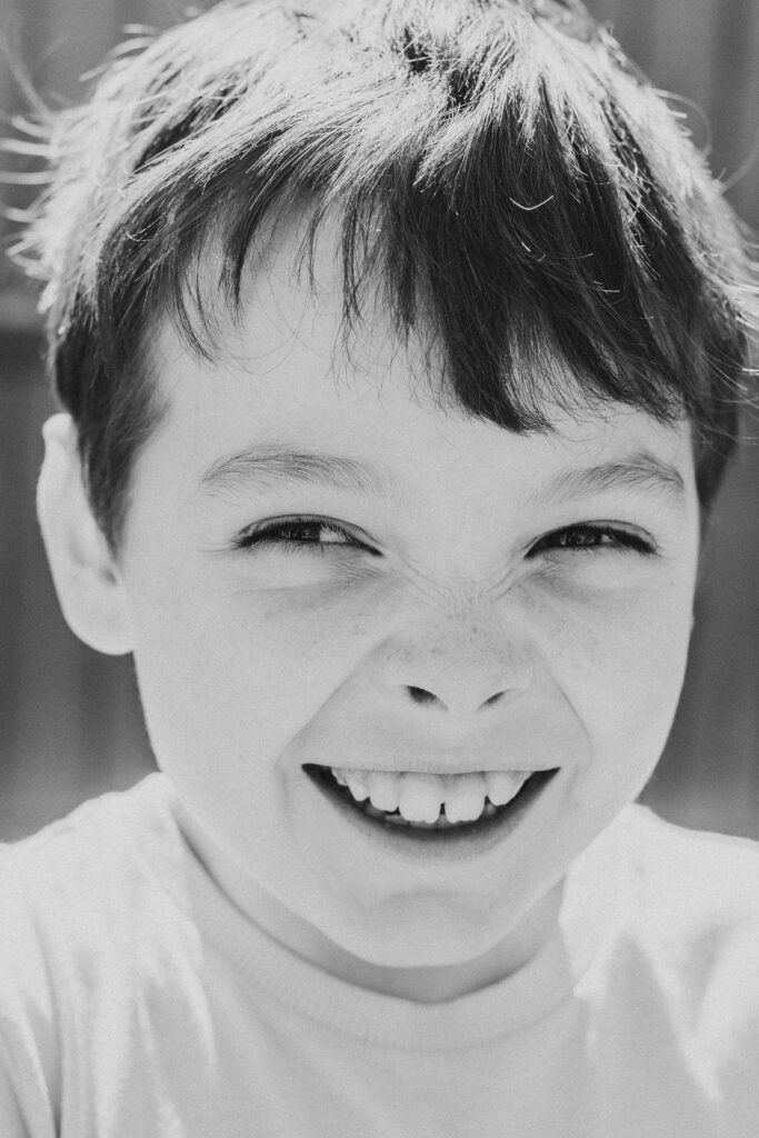 Boy smiling at west sussex family photoshoot