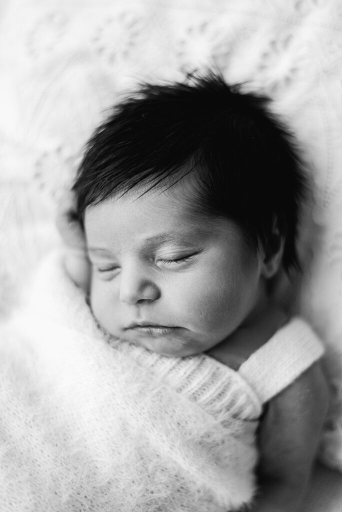 baby girl asleep in newborn photoshoot at Billingshurst studio