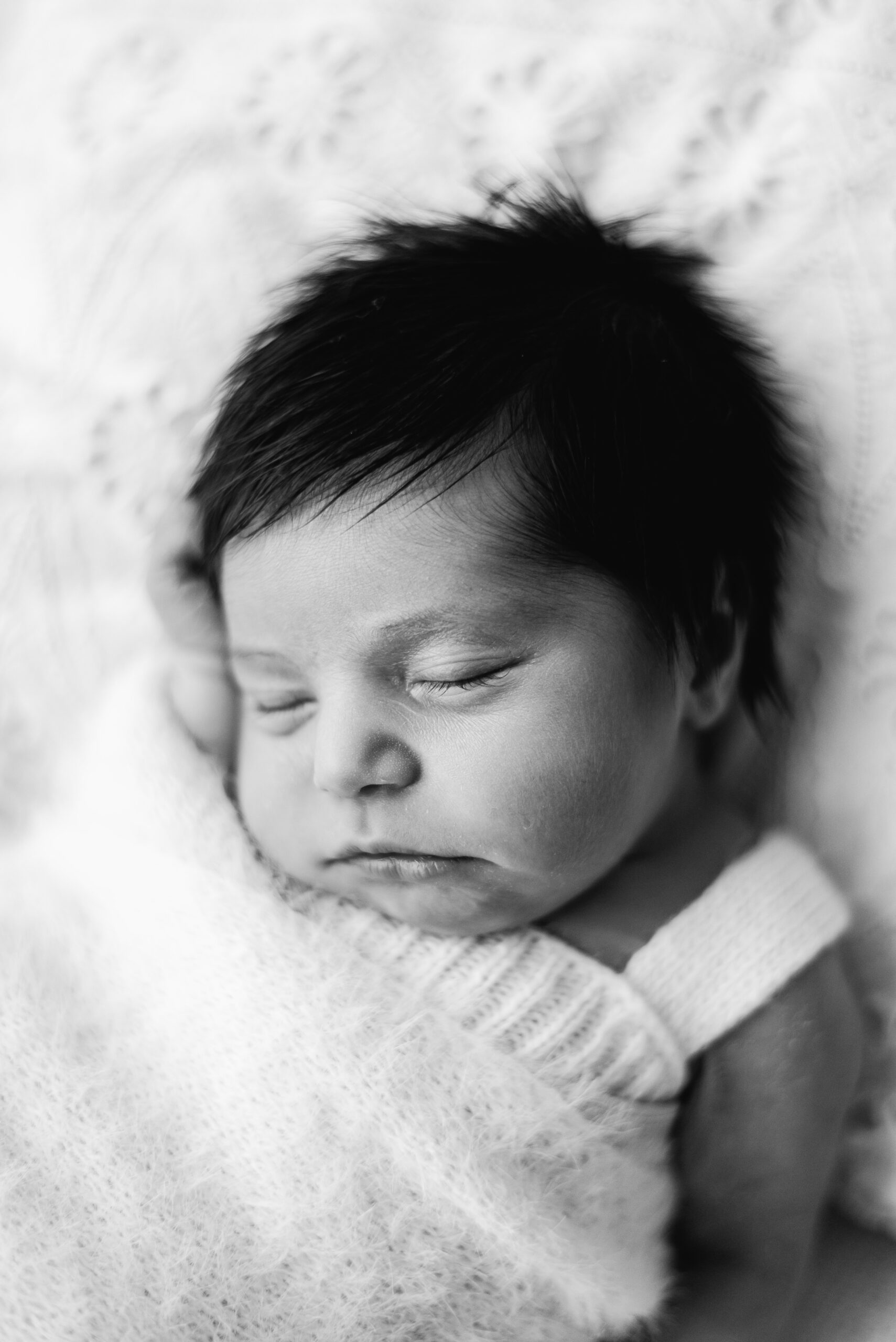 baby girl asleep in newborn photoshoot at Billingshurst studio