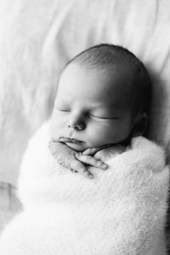 Baby boy asleep at a newborn photoshoot in Billingshurst