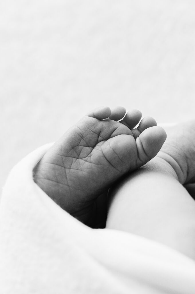 A detailed photo of a newborn baby foot during a photoshoot in Horsham