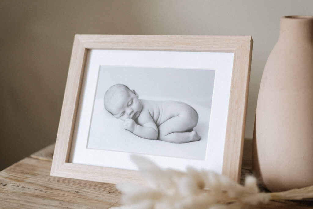 Newborn print inside a wooden frame at Horsham photoshoot
